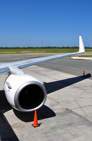 Air transportation: Jet engine and wing detail of a commercial airliner