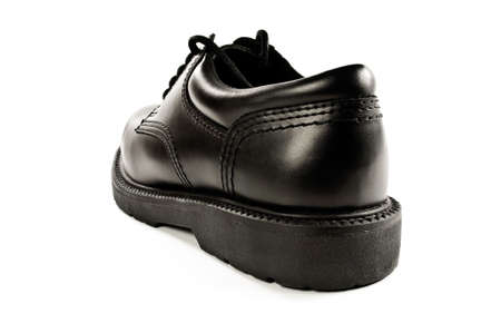 Back view of an isolated black leather shoe.の写真素材