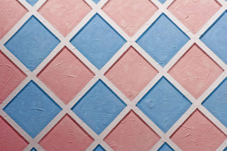 Diamond shaped pastel pattern painted on wall.の写真素材