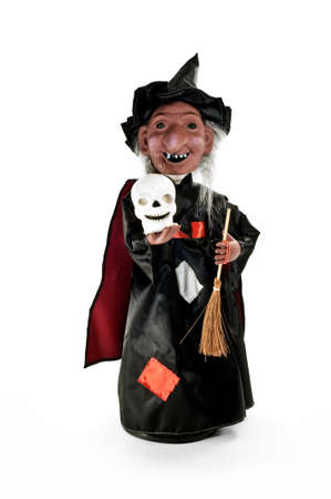 Smiling Halloween witch with broom on white background.の写真素材