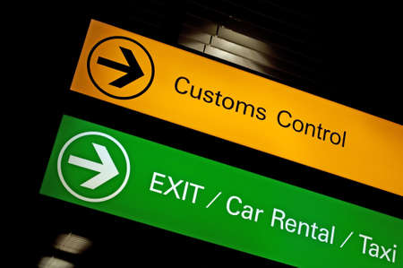 Airport customs, exit, car rental and taxi sign.の写真素材