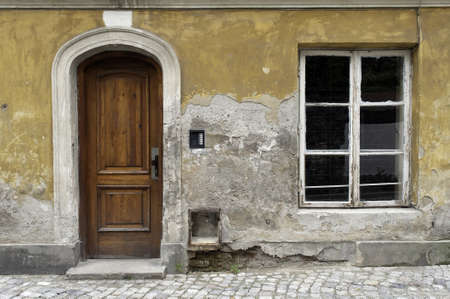 Simple, old, damaged house facade in Warsaw, Poland.のeditorial素材