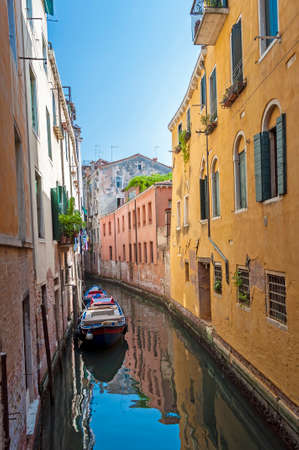 Boats and waterfront buildings in Venice, Italy の写真素材