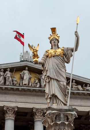 Statue of Pallas Athena, Goddess of Wisdom, standing in front of the Austrian Parliament building in...