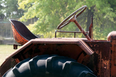 Close up view of an old, rusty, abandoned tractor.の写真素材