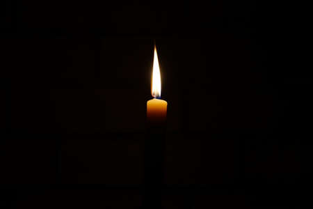 candle flame in the darkの写真素材