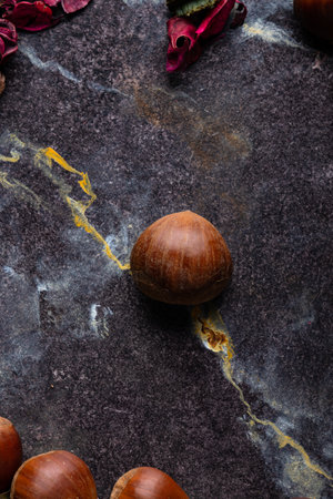 Hazelnuts on a dark stone background. Top view. Copy space.の写真素材