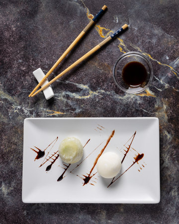 Japanese sushi with chopsticks and soy sauce on stone background. top viewの写真素材