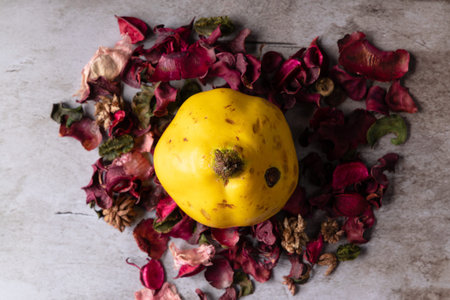Fifteen fruits with dry rose petals on wooden background. Healthy food concept.