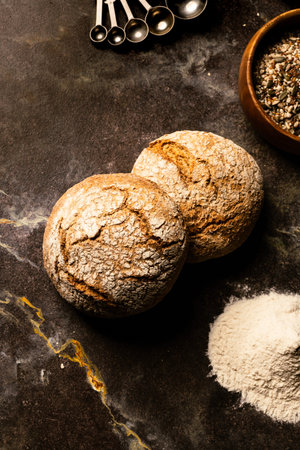 Freshly baked bread on dark background. Top view. Copy space.