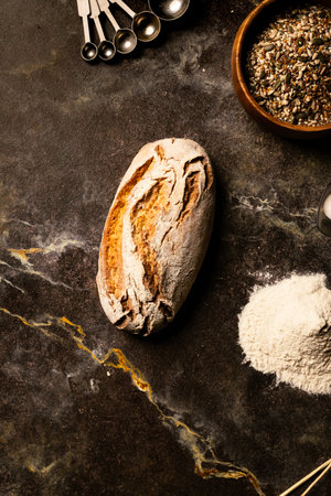 Freshly baked bread on dark background. Top view. Copy space.