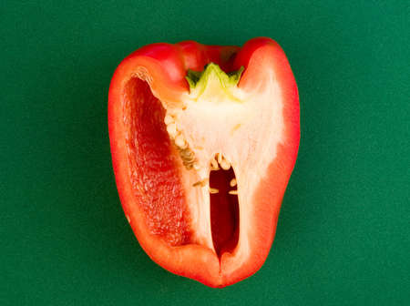 Red sweet pepper on a green backgroundの写真素材