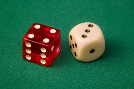 Two dice on table of games
