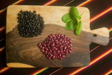 The snacks in the wood plank on a background tapestryの写真素材