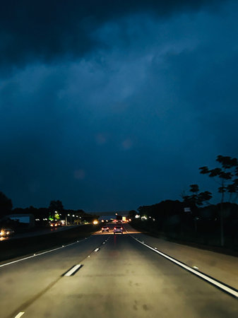 Driving on the highway in rainy weather, dark skies, closed weatherの写真素材