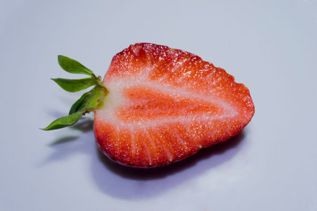 Ripe strawberries placed on white backgroundの写真素材