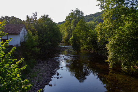 The landscape of Elizondo in Navarra with the BaztÃ¡n river. Elizondo is a town in the Foral...