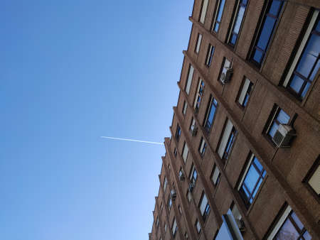 The white flash of the plane appearing through the building causing the lines to be cut, in Madrid, Spainの写真素材