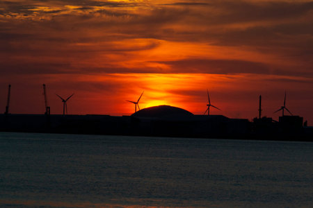 Sunset with orange color in the sky at Getxo-Guecho beach. Spanish municipality located on the coast...