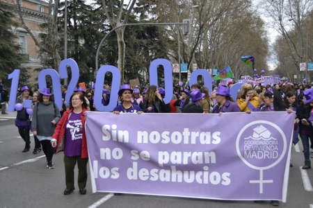 MADRID, SPAIN - MARCH 8, 2020: Demonstrators through the most emblematic streets of Madrid on March 8 revitalizing International Women's Day with banners. Horizontal photography.のeditorial素材