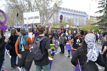 MADRID, SPAIN - MARCH 8, 2020: Demonstrators through the most emblematic streets of Madrid on March 8 revitalizing International Women's Day with banners. Horizontal photography.のeditorial素材
