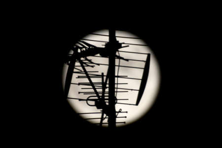 Super full moon with a dark background with an antenna in the foreground. Madrid, Spain, Europe. Horizontal Photography.の写真素材