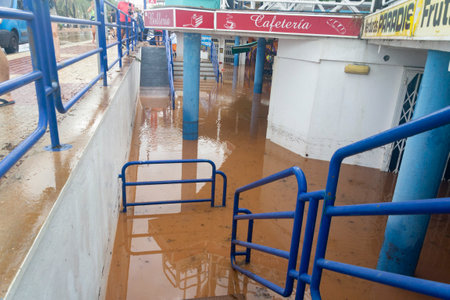 BENICÃSSIM - BENICÃSIM, SPAIN - AUGUST 29, 2021. Streets, promenades and beach flooded in the city of BenicÃ ssim after the rains and storms that flooded the town. Horizontal photography.のeditorial素材