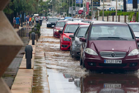 BENICÃSSIM - BENICÃSIM, SPAIN - AUGUST 29, 2021. Streets, promenades and beach flooded in the city of BenicÃ ssim after the rains and storms that flooded the town. Horizontal photography.のeditorial素材