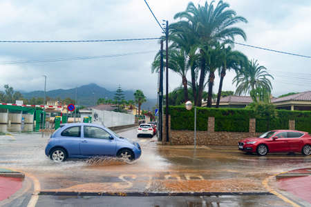 BENICÃSSIM - BENICÃSIM, SPAIN - AUGUST 29, 2021. Streets, promenades and beach flooded in the city of BenicÃ ssim after the rains and storms that flooded the town. Horizontal photography.のeditorial素材