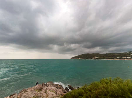 Overcast and gray sky in Oropesa del Mar next to the Mediterranean Sea, in CastellÃ³n, in Spain. Europe. Horizontal photography.の写真素材