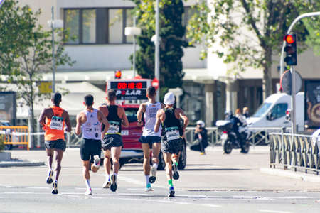 MADRID, SPAIN - SEPTEMBER 26, 2021. Group of professional athletes walking the streets of Madrid doing the Madrid Half Marathon. Chema Martinez. In Spain. Europe.のeditorial素材