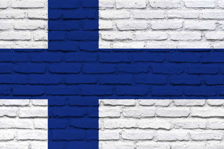 Finland flag. Isolated national flag of Finland. Brick wall texture. Horizontal design.の写真素材