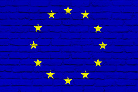 European Union flag, official colors and proportion correctly. Illustration. Flag with brick wall...