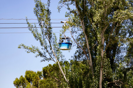 Cable way. Cable car in Madrid that connects the Parque del Oeste with the Casa de Campo in Madrid. Clear day with a blue sky, in Spain. Europe. Photography.の写真素材