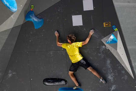 climbing. Young person climbing in the Madrid Block Climbing Spanish Cup held in Madrid's Plaza de EspaÃ±a. Climbers.のeditorial素材