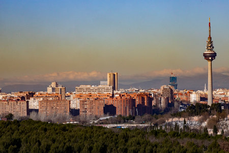 Madrid. Pollution. pollution. Views of the city of Madrid with a gray and brown layer of pollution beret over the city. Sierra de Guadarrama with snow on the mountain. photographyの写真素材