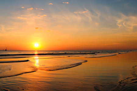 Sunset. sunrise. Sunset on the shore of the beach with the sea calm and soft waves. Tranquility concept.の写真素材