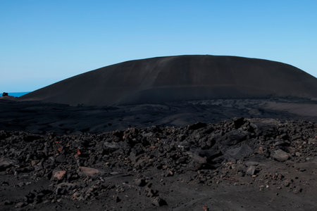 volcano. Wash. Magma. Volcanic cone with lava and eruption of hot rocks.の素材