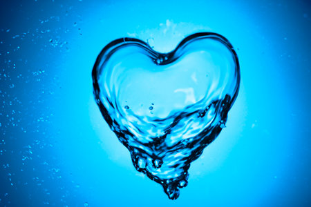 Blue water splash. Splash of water flow with bubble. Close up water. Fresh blue natural drink water.の素材