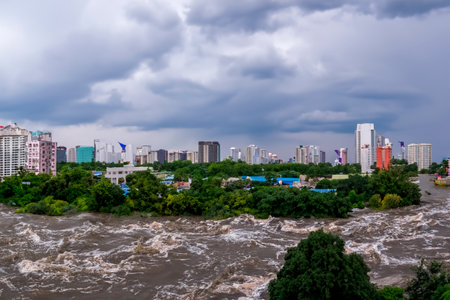 Flash flood. Torrential rains that fill the rivers and roads instantly causing flooding. Rain concept. Torrential rain. floods.の素材