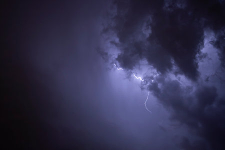 Ray. Storm. The sky is full of dark clouds in bad weather before a big storm rain. Light emission from the Edge of clouds. Zoom the surface of a Black haze at close range.の写真素材