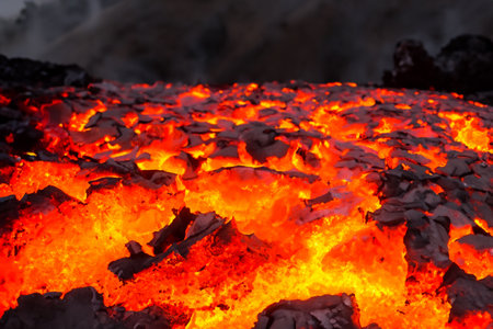 Etna. They overturn with magma on the walls of the volcanic cone. Hot wash. New eruption. 2023. Hot rocks.の素材