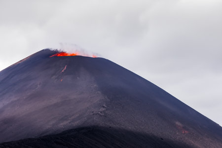 Etna. They overturn with magma on the walls of the volcanic cone. Hot wash. New eruption. 2023. Hot rocks.の素材