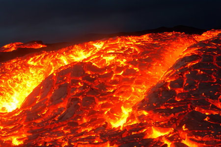 Etna. They overturn with magma on the walls of the volcanic cone. Hot wash. New eruption. 2023. Hot rocks.の素材