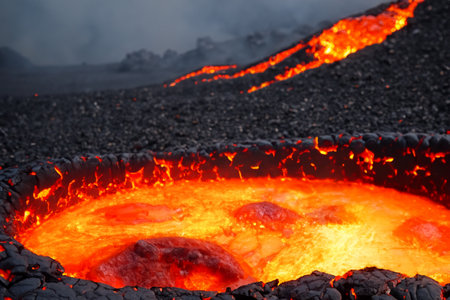 Etna. They overturn with magma on the walls of the volcanic cone. Hot wash. New eruption. 2023. Hot rocks.の素材