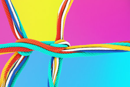 Team rope diverse strength connect partnership together teamwork unity communicate support. Strong diverse network rope team concept integrate braid color background cooperation emの写真素材