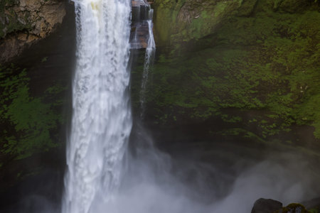 Waterfall. Majestic waterfall. Panoramic beautiful deep forest waterfall. Fantasy landscape with...