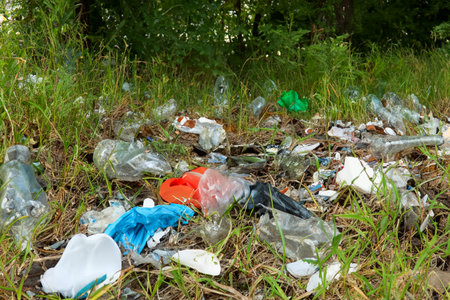 Rubbish. Liter. Garbage in nature. Group of eco volunteers picking up plastic trash in park....
