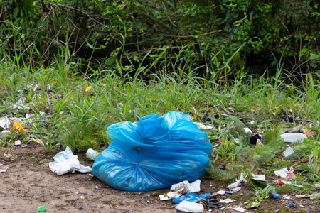 Rubbish. Liter. Garbage in nature. Group of eco volunteers picking up plastic trash in park....
