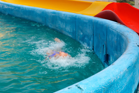 Swimming pool. Inflatable floating in swimming pool on sunny day. Top view. With space for text. Summer color concept. Summer and heat concept.の写真素材